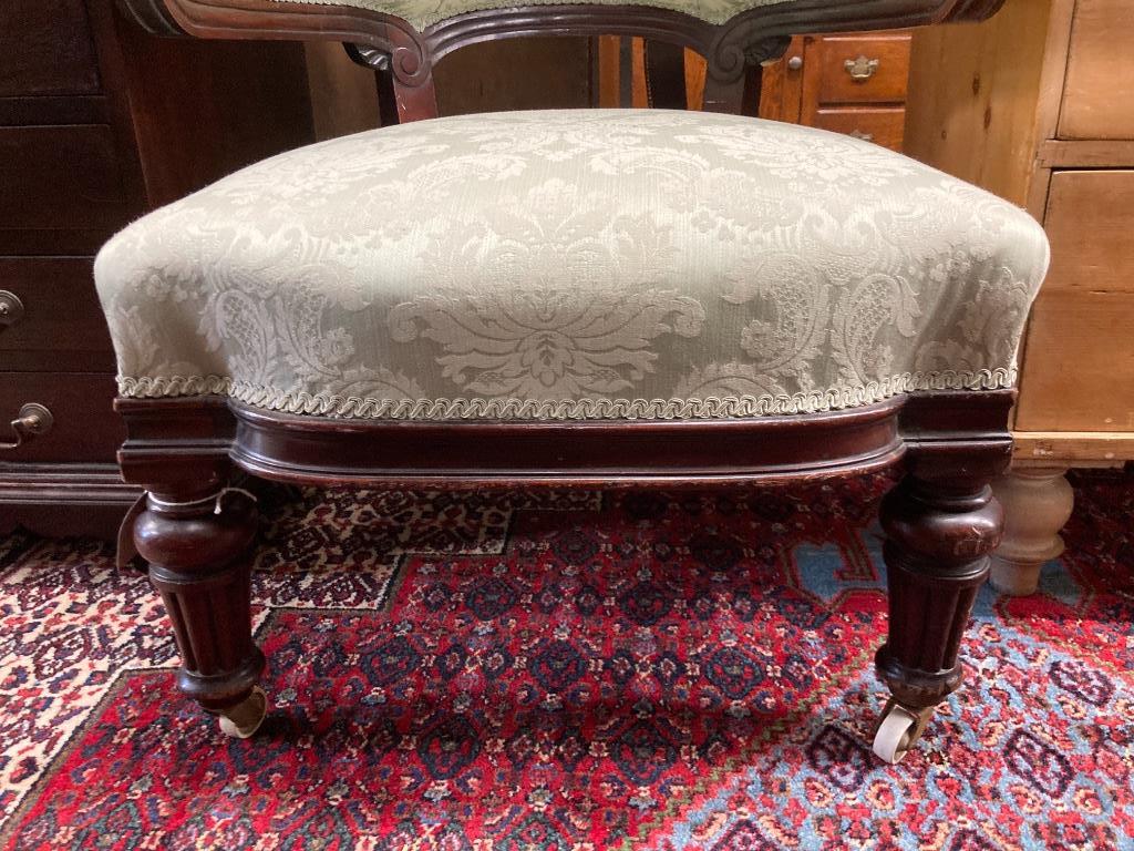 A Victorian carved mahogany upholstered armchair, width 72cm, depth 64cm, height 91cm